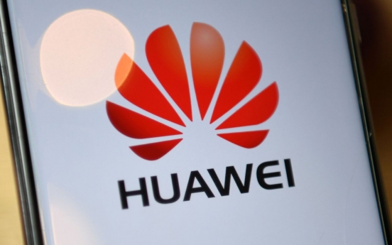 China urges 'fair' treatment after France restricts Huawei