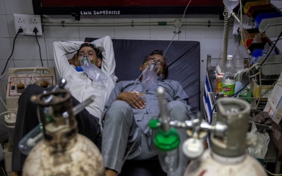 India virus cases spiral as Baghdad hospital blaze kills 82