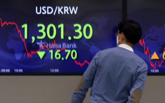 Seoul shares end higher ahead of key US inflation data