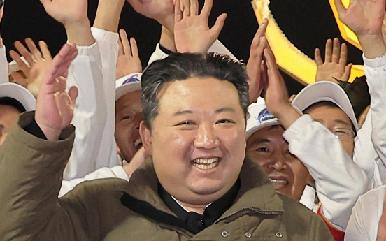 N. Korean leader lauds military spy satellite as 'space guard'