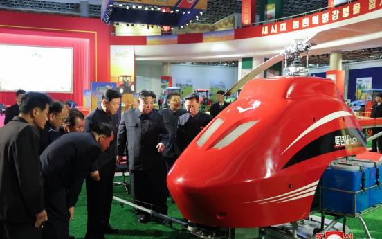 N. Korean leader attends farm machinery exhibition