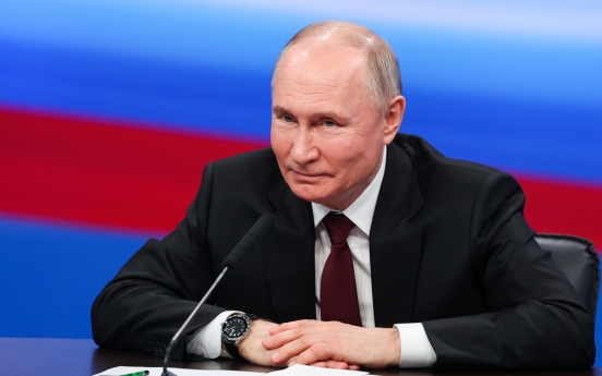 Putin wins election in landslide with no serious competition