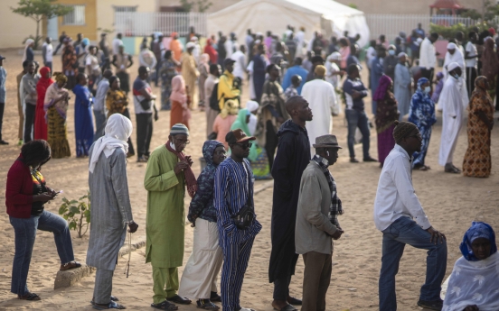 Senegal votes in a tightly contested presidential race after months of unrest