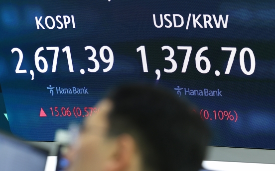 Seoul shares open higher on large cap gains