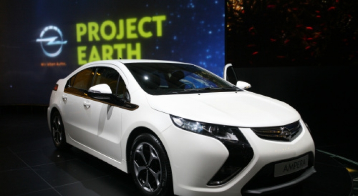 Carmakers count on green tech to offset costly fuel