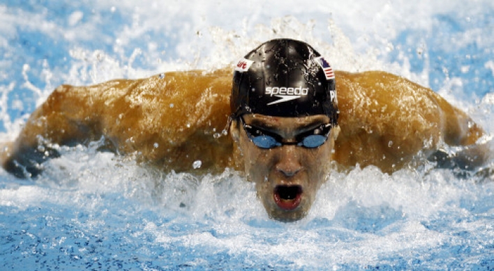 Phelps takes 3rd gold at swimming worlds