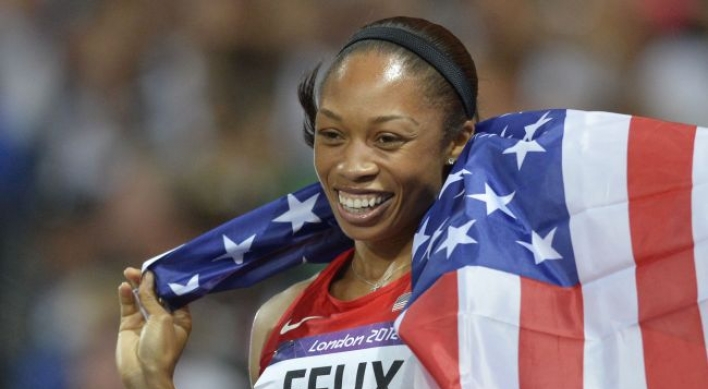 Third time lucky as Felix wins women's 200m gold