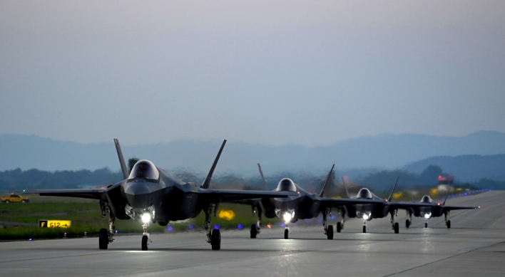 S. Korea flies fighters near border over NK spy satellite plan