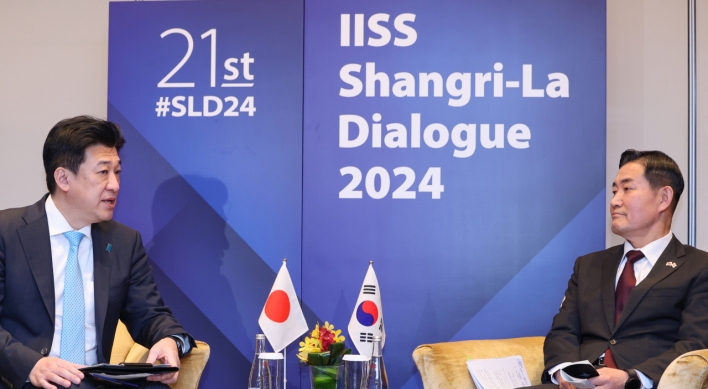 South Korea, Japan defense chiefs agree to put past behind them at Singapore meeting
