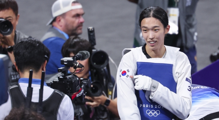 Unheralded athlete reaches top of taekwondo podium after taking detour to Paris