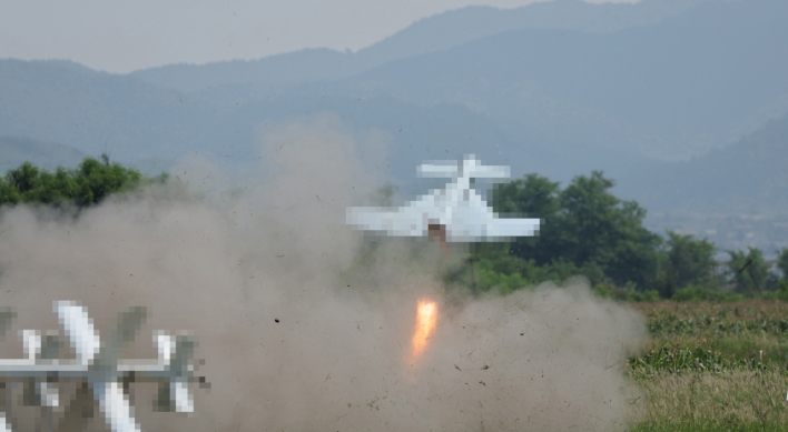 N. Korean leader oversees suicide drones test, calls for more production