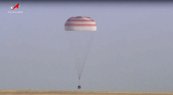 Soyuz capsule with 2 Russians and 1 American from the International Space Station returns to Earth