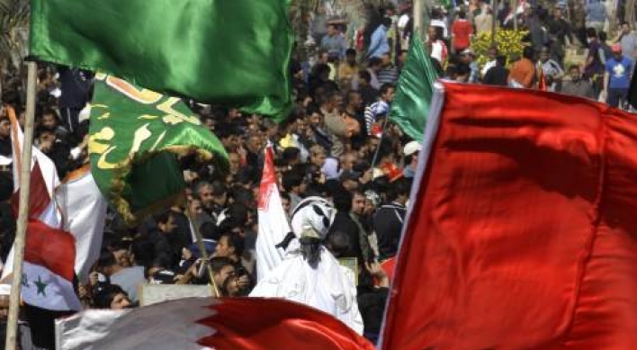 Bahrain curfew as uprising surges