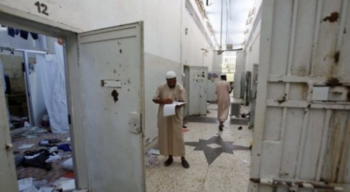 Liberated inmates tell of 'dark age' under Gadhafi