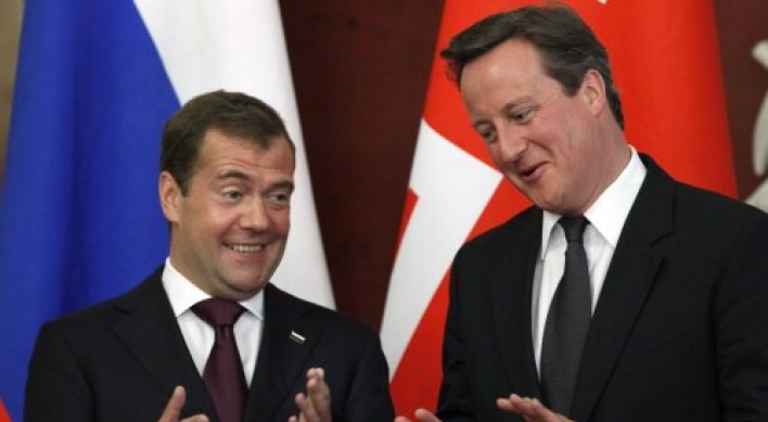Cameron urges U.K., Russia to mend trade ties