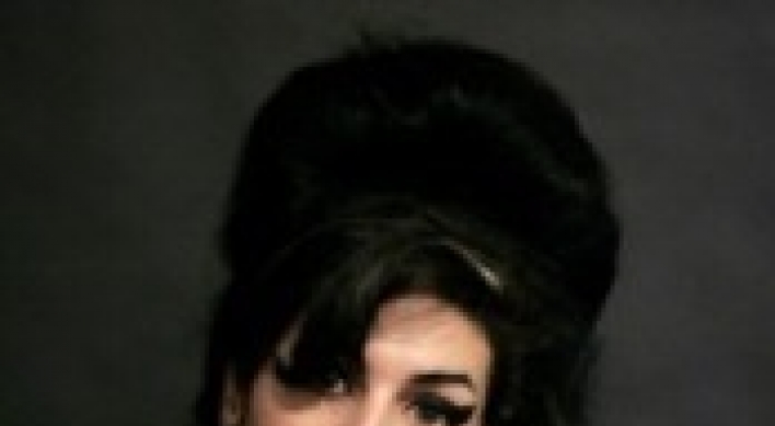 Coroner: Amy Winehouse died from too much alcohol