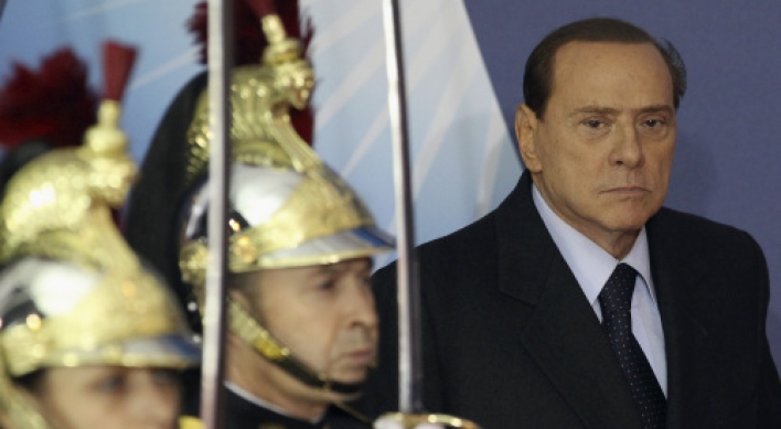 Italy's Berlusconi to resign after reforms pass