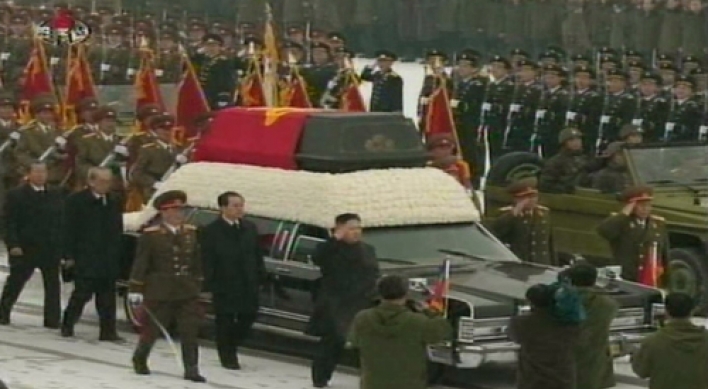 Heir leads funeral for late leader