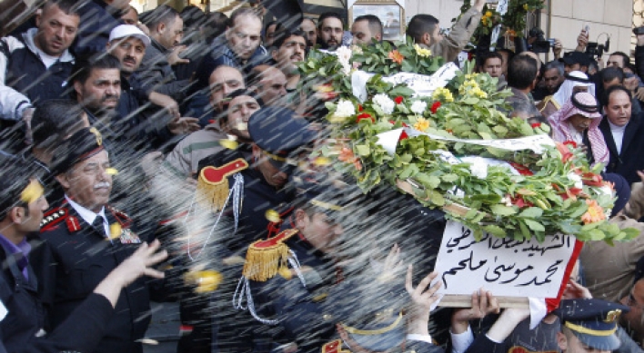 Syria buries bomb victims, threatens ‘iron fist’