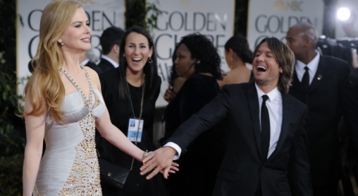 Dressed-up stars arrive for glitzy Golden Globes