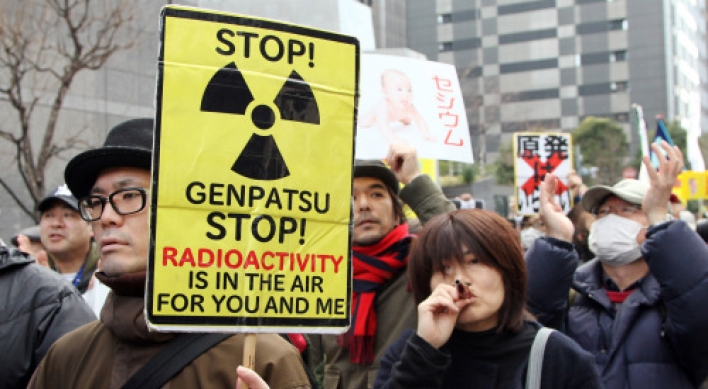 Protesters link arms around the world to decry nuclear power