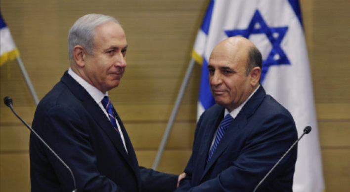 Israel P.M. unveils shock coalition deal with Kadima