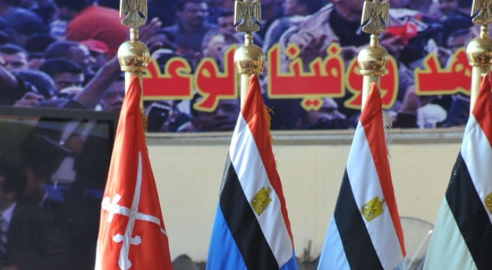 Egypt’s elected president begins struggle for power