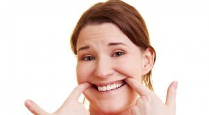 Smiling during stress may help the heart