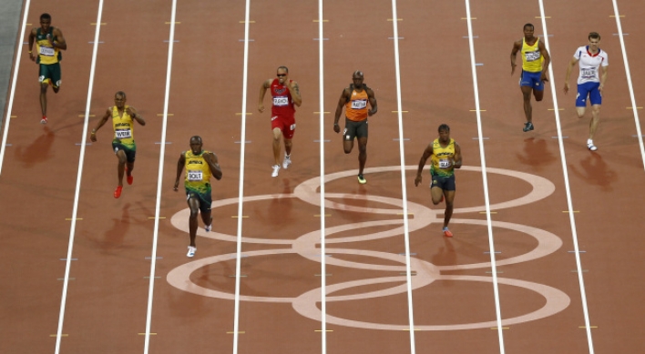 Usain Bolt first man to duplicate 100-200m Olympic double