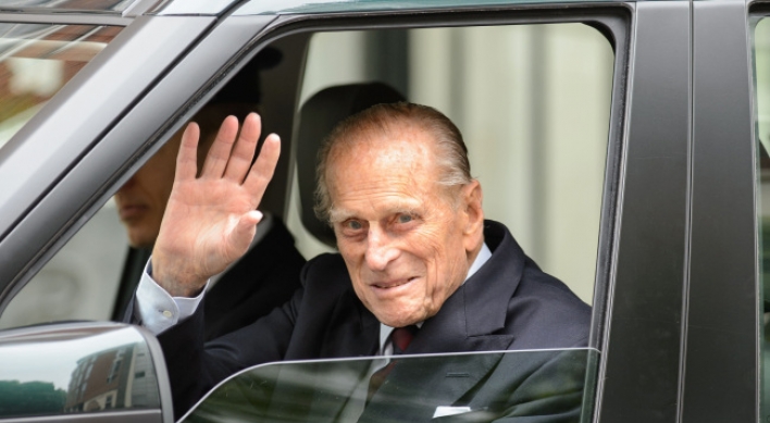 Britain’s Prince Philip leaves hospital after surgery