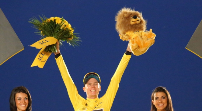 Froome rides to victory in 100th Tour de France