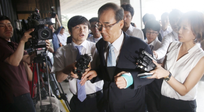 Former tax chief appears for questioning over bribery
