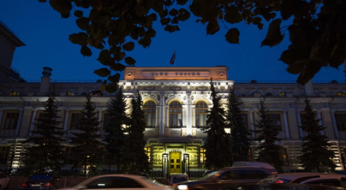 Russian central bank limits interventions, lets ruble float