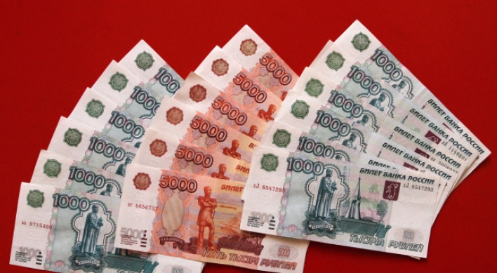 Western sanctions, ruble crash hit Russians hard