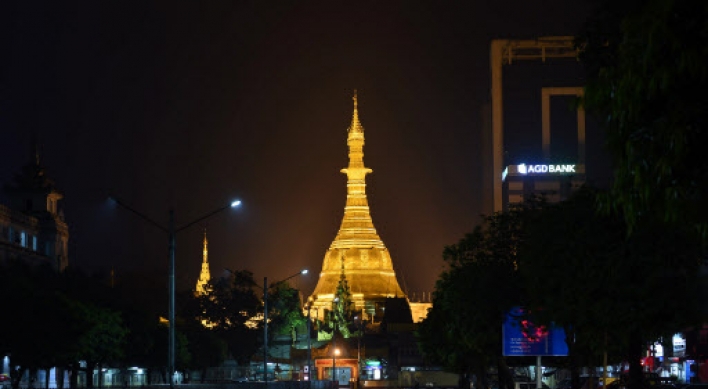 Myanmar pagoda re-clad with gold blocks as devotees look to gain spiritual credit