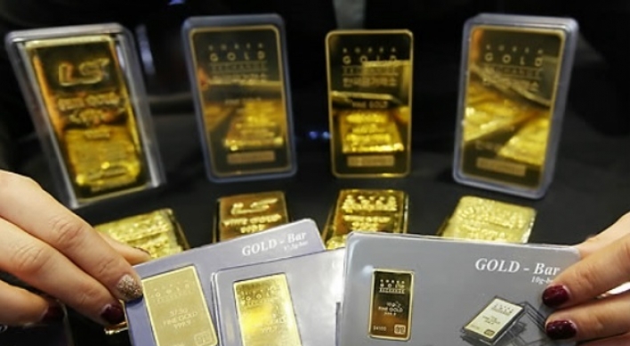 Gold reaches record high in morning trading