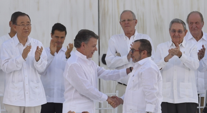 [Newsmaker] Santos, Timochenko: Colombia foes turned peacemakers