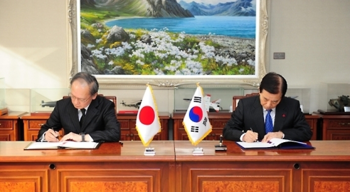 Korea, Japan sign pact to share military information