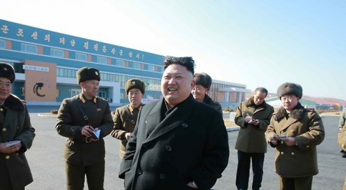 NK leader smiles during inspection of catfish farm following brother's death