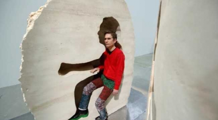 French artist is entombed in rock for a week