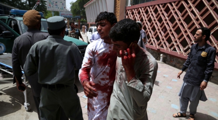 At least nine dead as bomb, gun battle rages in Afghan city