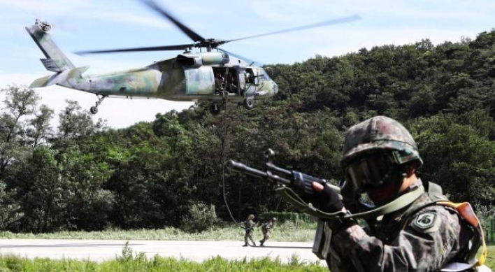 Korea halts its own military drill amid dialogue mood