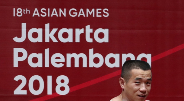 N. Korea's Om Yun-chol defends weightlifting title