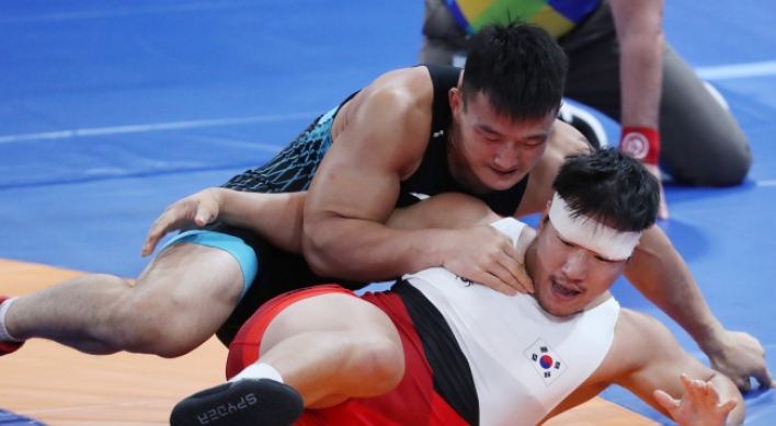 Greco-Roman wrestler Cho Hyo-chul wins gold in men's 97kg