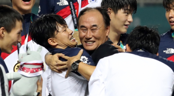 S. Korean football coach says gold medal victory made by players