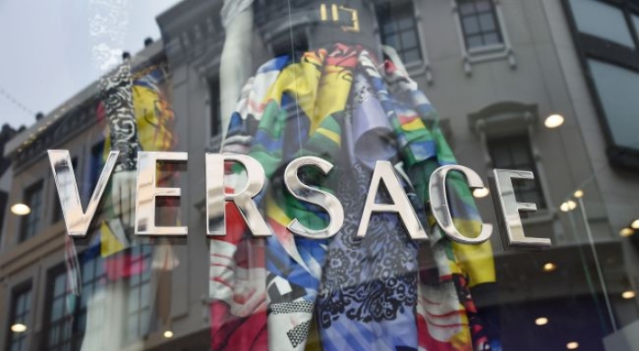 Michael Kors ups the glamour, buys Versace for $2 billion