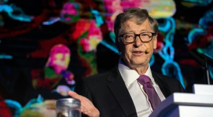 Poop in hand, Bill Gates backs China's toilet revolution