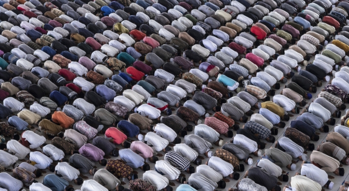 Muslims begin marking a subdued Ramadan under virus closures