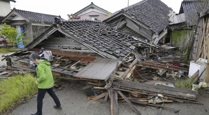 Aftershocks shake Japan after quake kills one, destroys homes