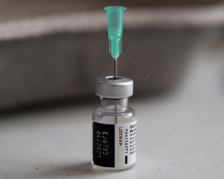 Japan formally approves its first COVID-19 vaccine